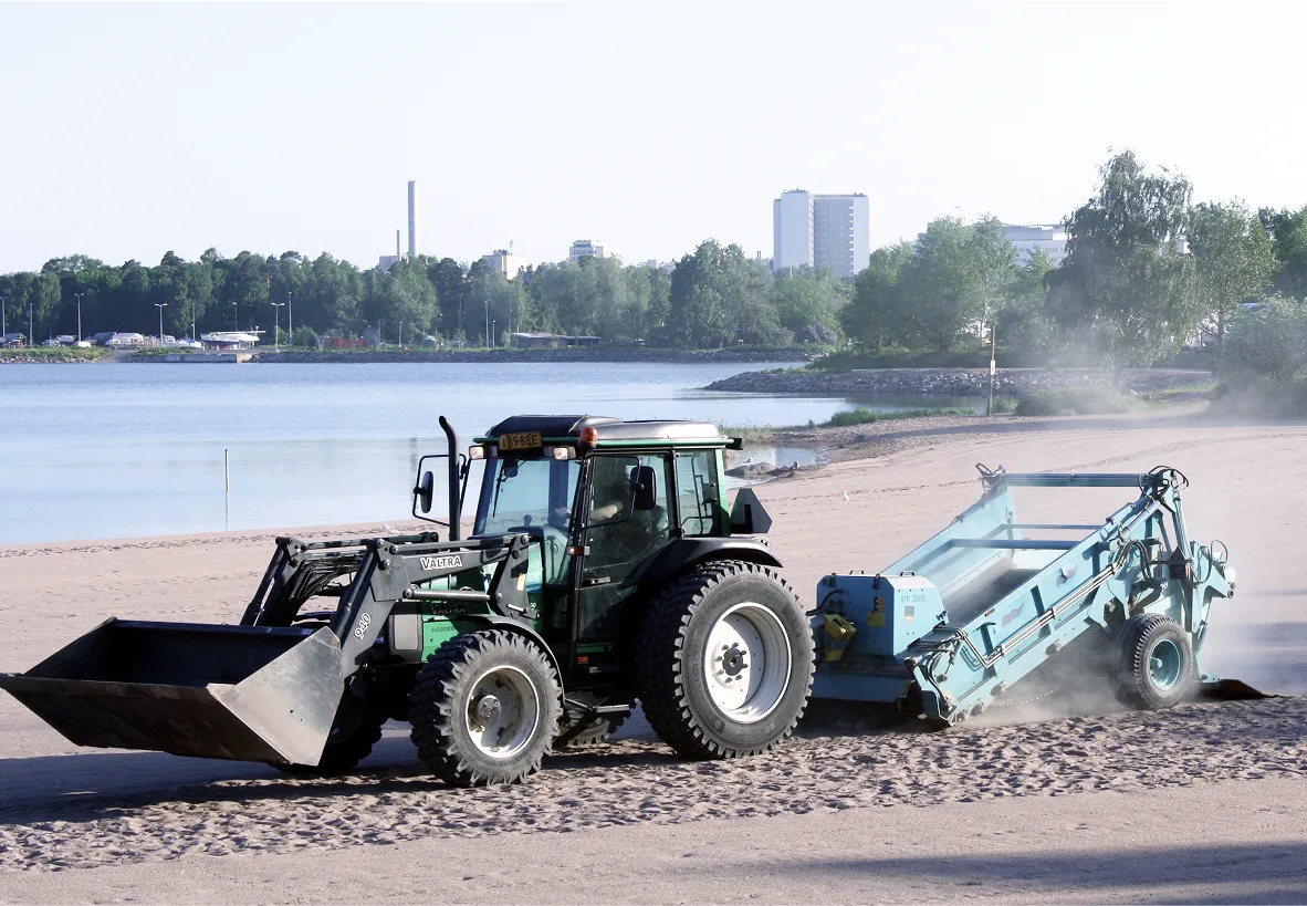 Tractor cleaning the beach